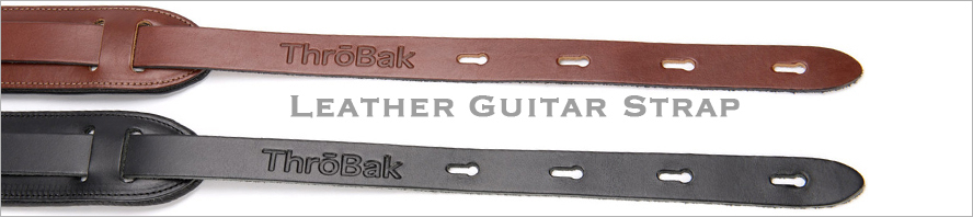 Throbak leather guitar strap button photo.